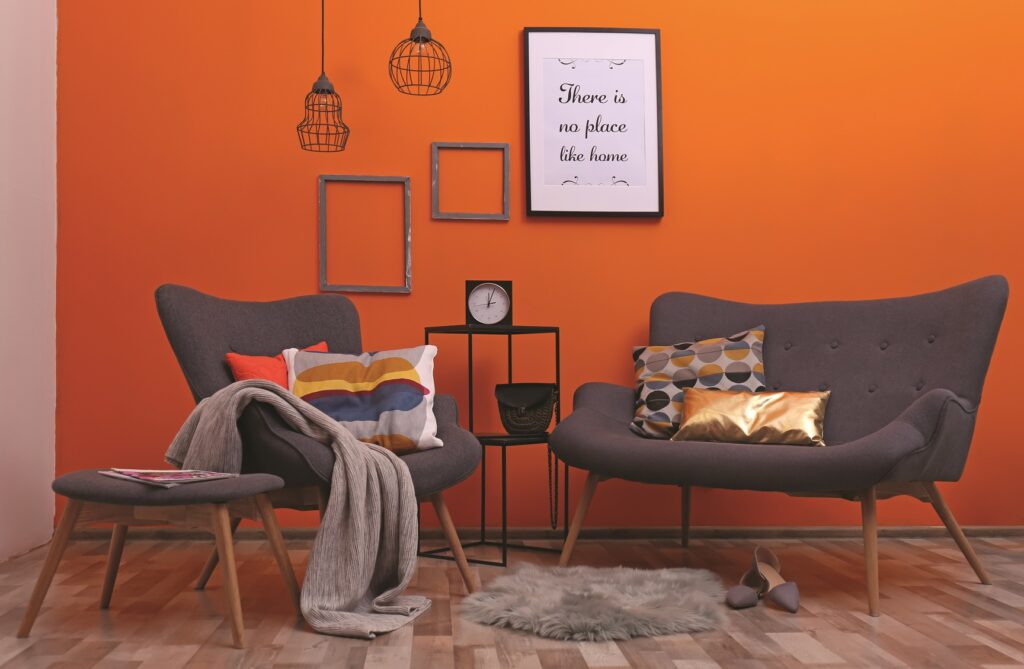 Modern apartment with comfortable armchair and sofa